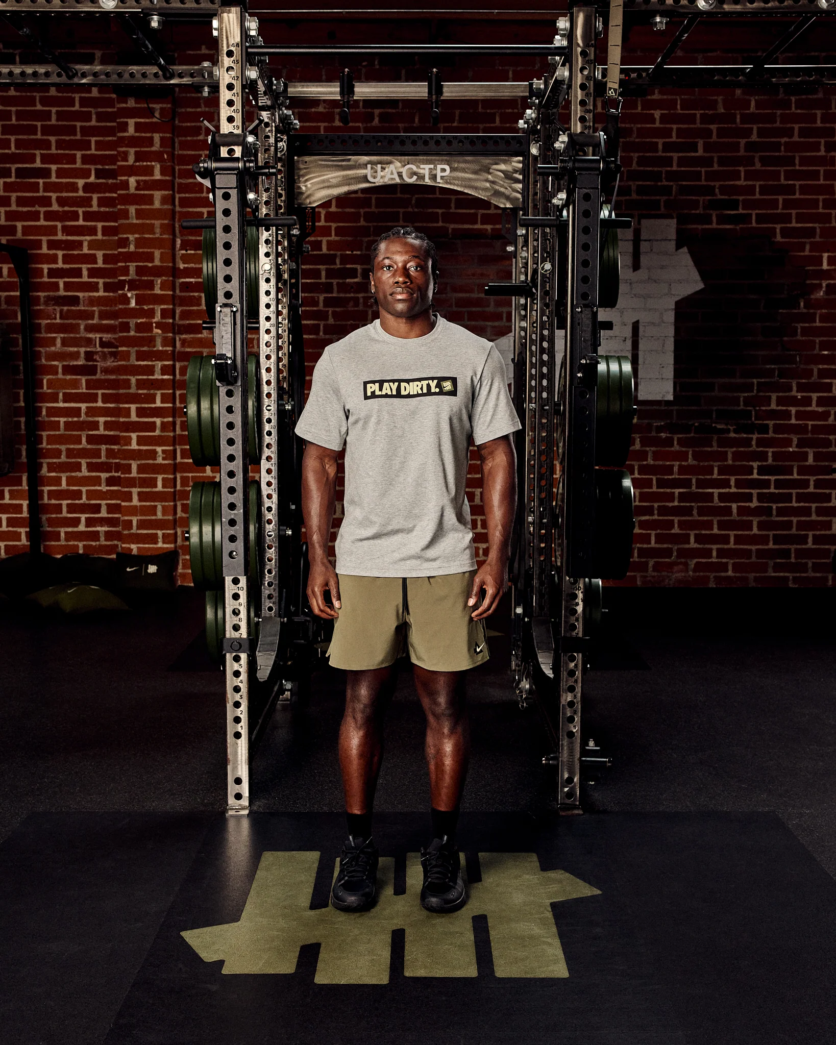 UACTP X NIKE NRG PRIMARY SS TOP - DK GREY HEATHER