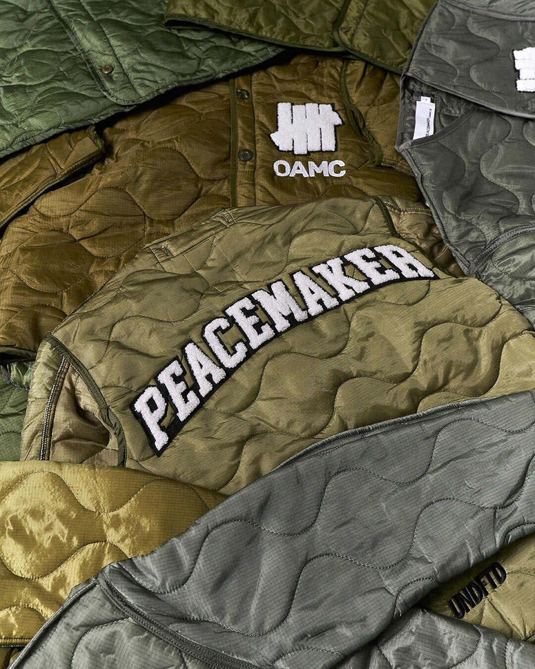 UNDEFEATED X OAMC PEACEMAKER LINER JACKET - OLIVE